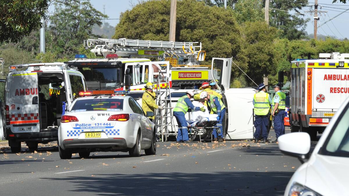 A Toyota Hilux landed on its side this morning following a collision in a Central Wagga street. Picture: Kieren L Tilly