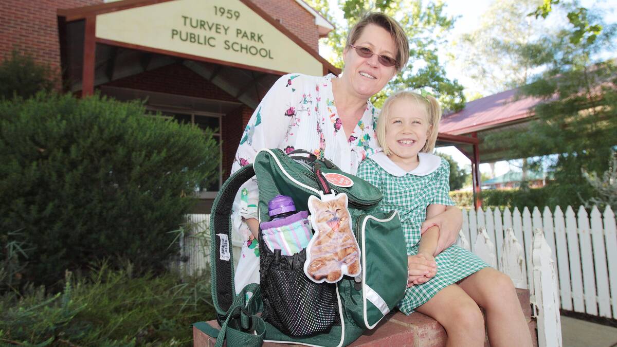 Wagga's Melinda Whyte farewells daughter Amelie Hoff, 5, on her first day of kindergarten at Turvey Park Public School, the same school she saw her out her primary years 41 years ago. Picture: Kieren L Tilly
