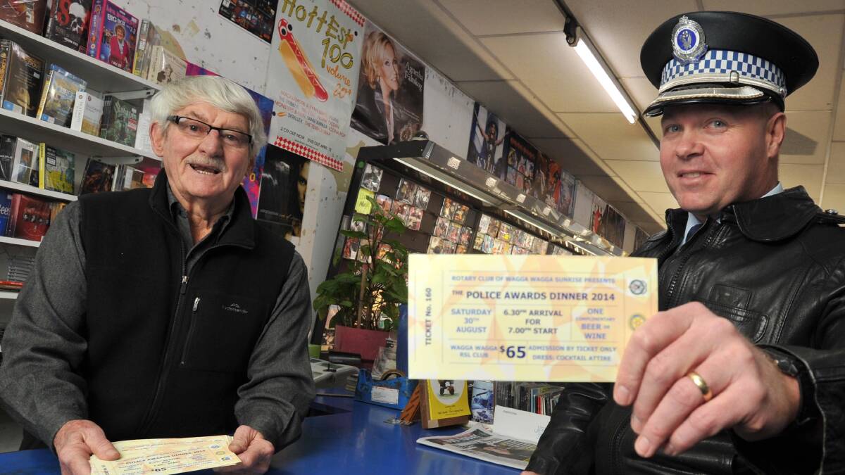 Don Tuckwell and Superintendent Bob Noble are selling tickets to the police officer of the year awards at the Wagga RSL Club on August 30. Picture: Michael Frogley