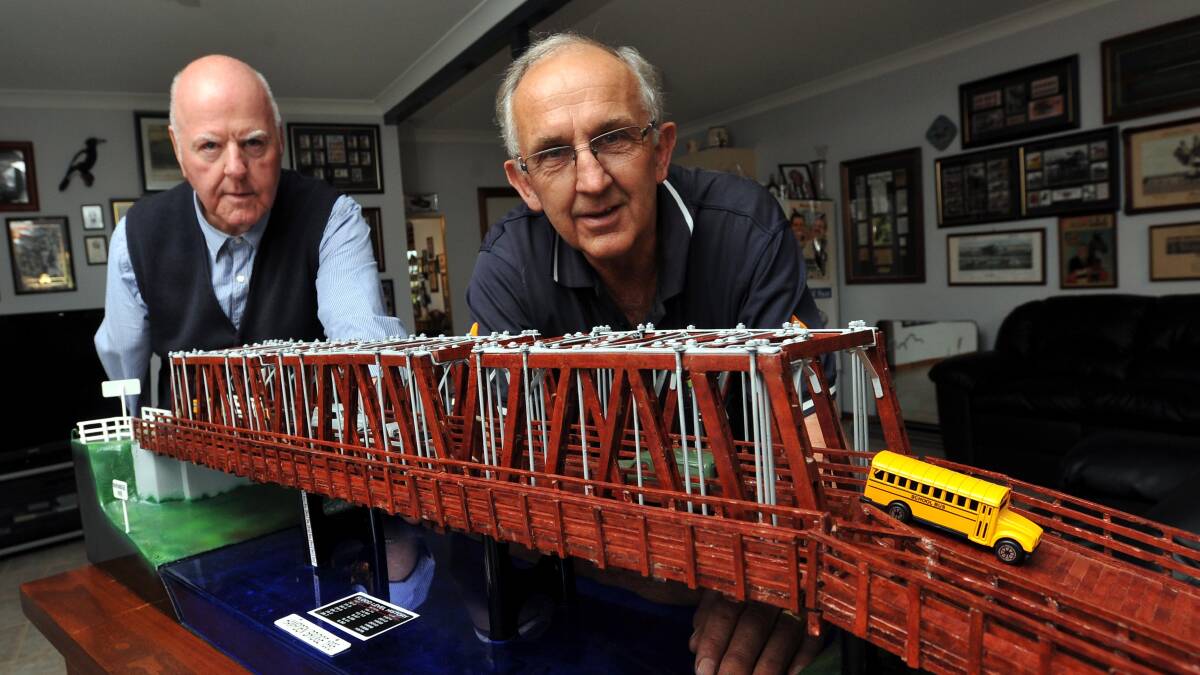 LOST BUT NOT FORGOTTEN: Model bridge owner (left) Terry Ahern and model builder (right(  Allan Langfield hope this model of the Hampden Bridge will ensure the Wagga icon is never forgotten. Picture: Laura Hardwick 