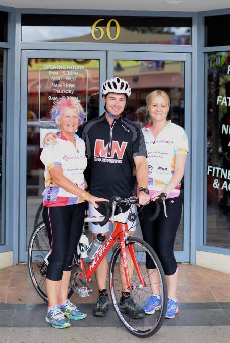 CYCLING FOR A CURE: Riding 1900 kilometres to raise money for melanoma which took the life of his sister, (centre) Raphael McGowan is supported by his mother (left) Bernie McGowan and sister (right) Mim McGowan. Picture: Jacinta Coyne 