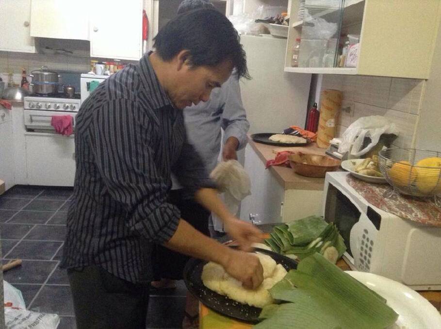PREPARING FOOD: Ah Lat Lagang prepares traditional food. Picture: Contrbuted