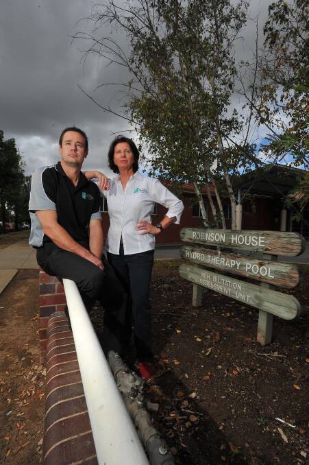 UNHAPPY: Physiotherapists (left) Aaron Miles and (right) Helen Hicks are concerned about the future of the hydrotherapy pool at Wagga Base. Picture: Kieren L Tilly