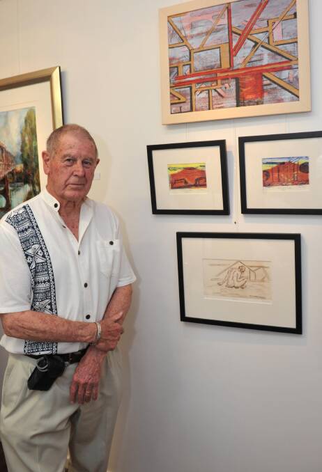ART OF MOURNING: The Hampden Bridge, a former gateway to the city, is remembered in art form. Artist Craig Couzens stands with some of pieces. 					Picture: Michael Frogley