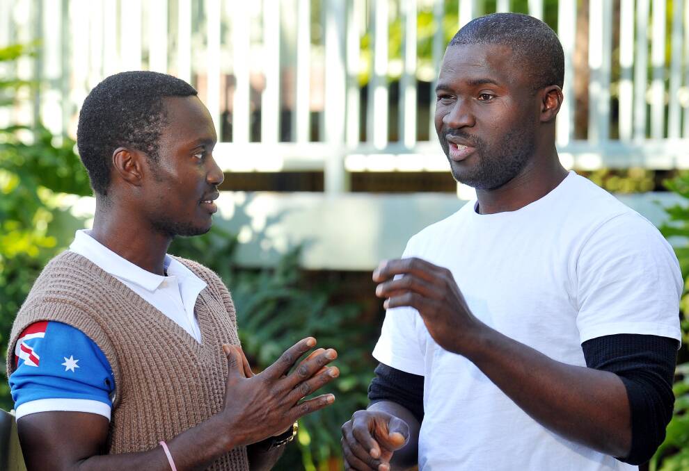 PRAYING FOR AFRICA: Wagga men Frank Newah-Jarfoi and Emmanuel Wilkinson are spreading the awareness of the deadly virus Ebola that has ravaged Africa. Picture: Kieren L Tilly 