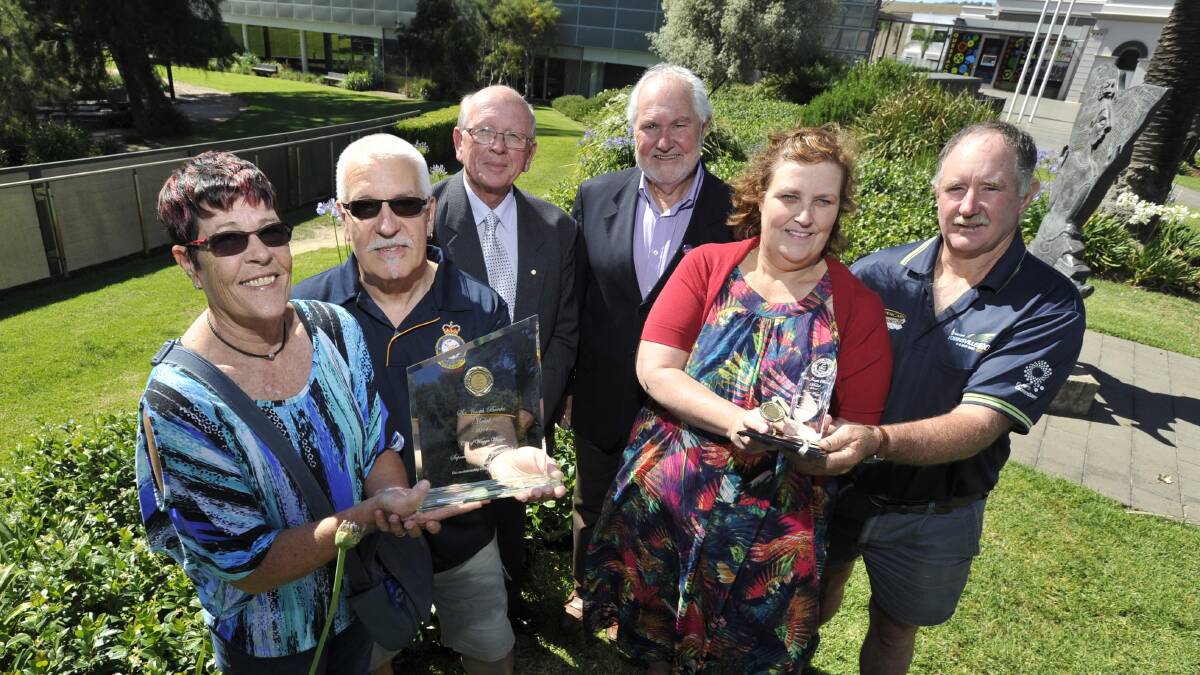 WINNERS ARE GRINNERS: Supreme Nature Strip award winners Sue and Peter Lyzun with Sir Joseph Banks medal co-ordinator Peter Moloney and mayor Rod Kendall, alongside winners of the Supreme Residential award winners Donna and Joe Nicholl. Picture: Les Smith
