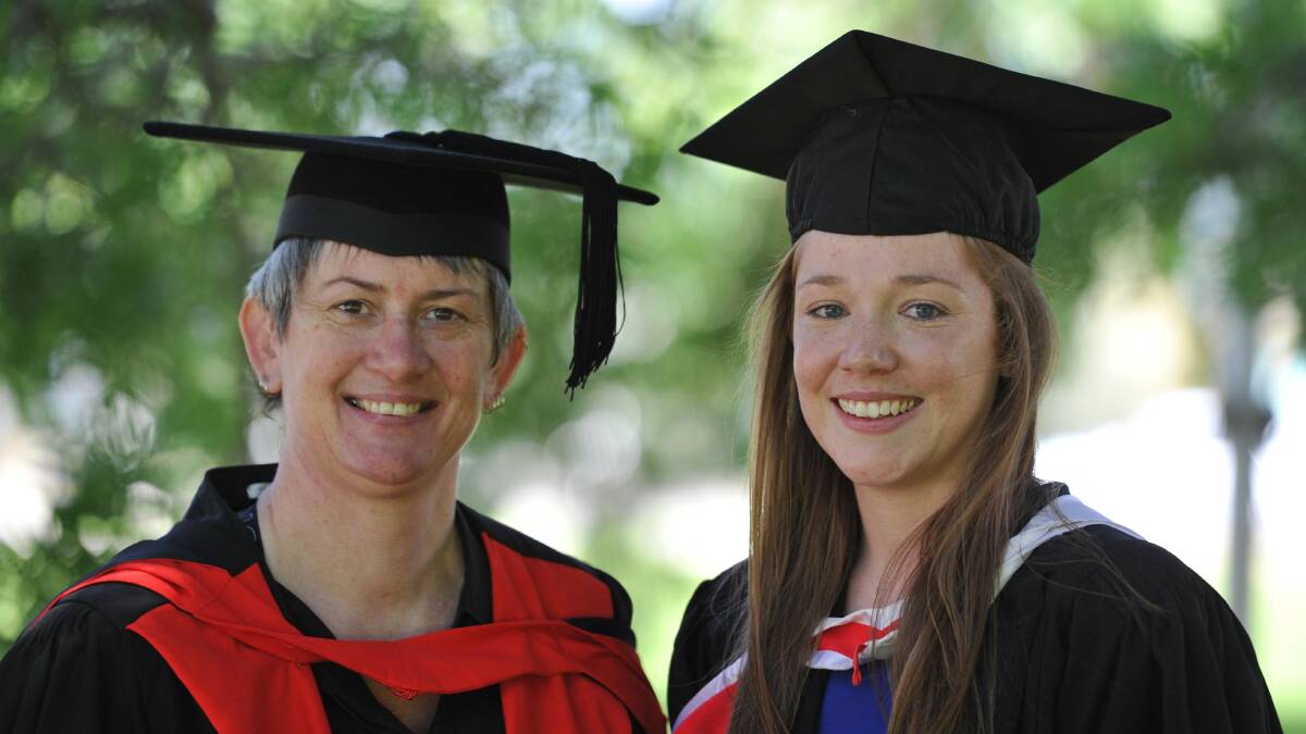 Bachelor of Social Work graduate Lucy Holbrook (right) with course director and senior lecturer Cate Thomas. Picture: Michael Frogley