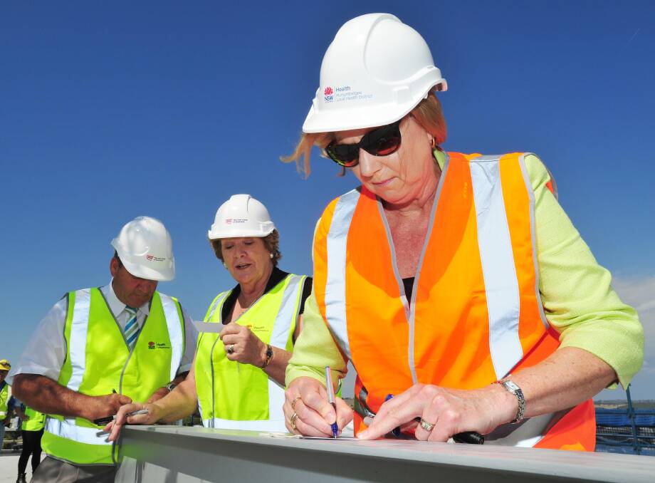 Member for Wagga Daryl Maguire, Health Minister Jillian Skinner and Murrumbidgee Local Health District chief executive Jill Ludford sign wish cards to attach to a tree that will be planted inside the grounds of the new hospital. Picture: Kieren L Tilly