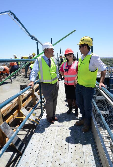 Member for Wagga Daryl Maguire chats to Wagga Base Hospital redevelopment executive manager Irene Hing and Hansen Yuncken project manager Michael Martin about the helipad. Picture: Supplied