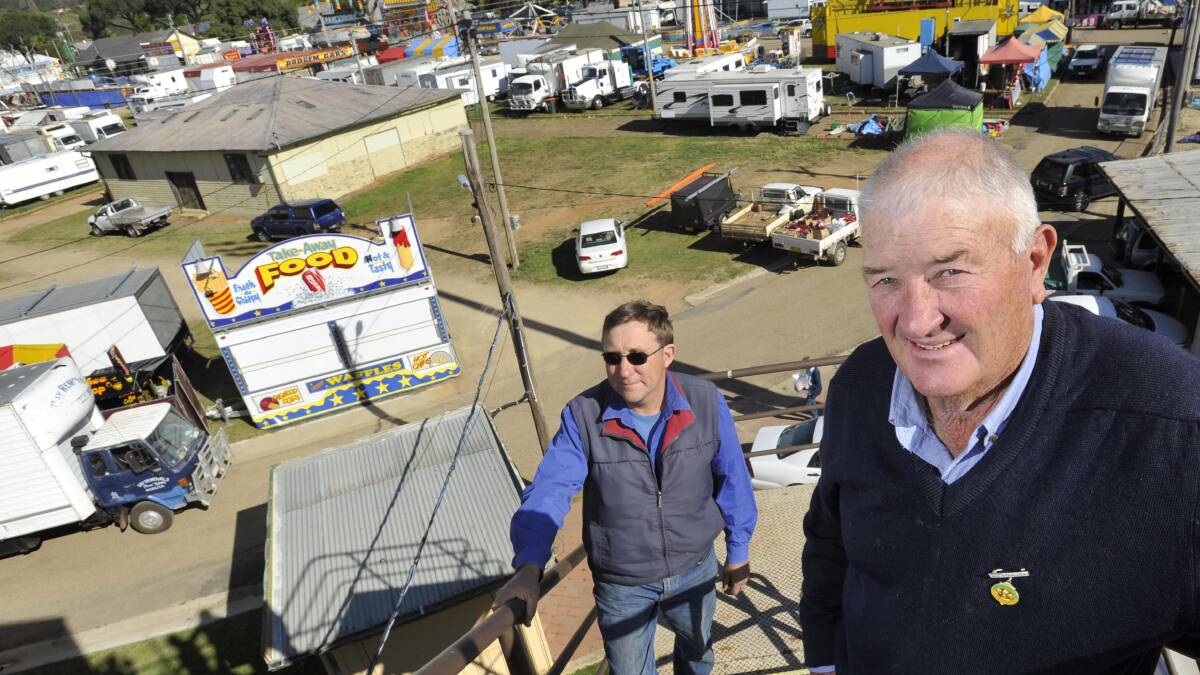 Wagga Show Society president Brett Grant and treasurer John Stewart take in a bird's eye view of the Wagga Show on Thursday as it sets up for another year. Picture: Les Smith
