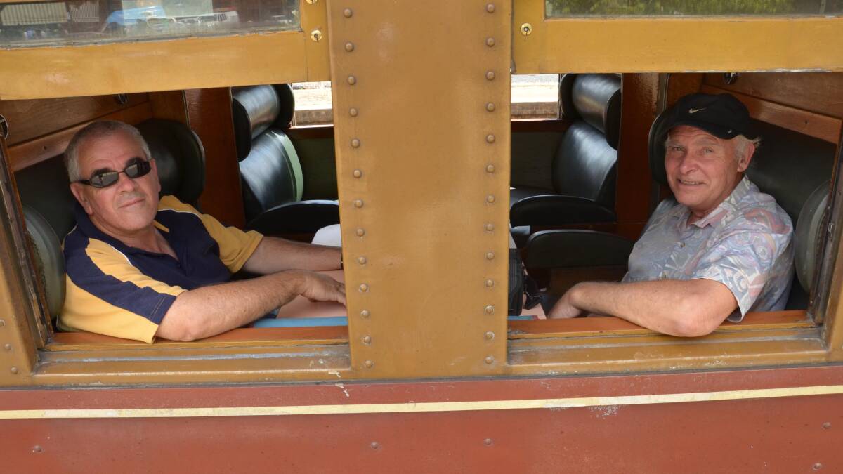Chris Rayfield and Ian Smith, both from Sydney, head to Wagga on the steam train 3265. Picture: Declan Rurenga
