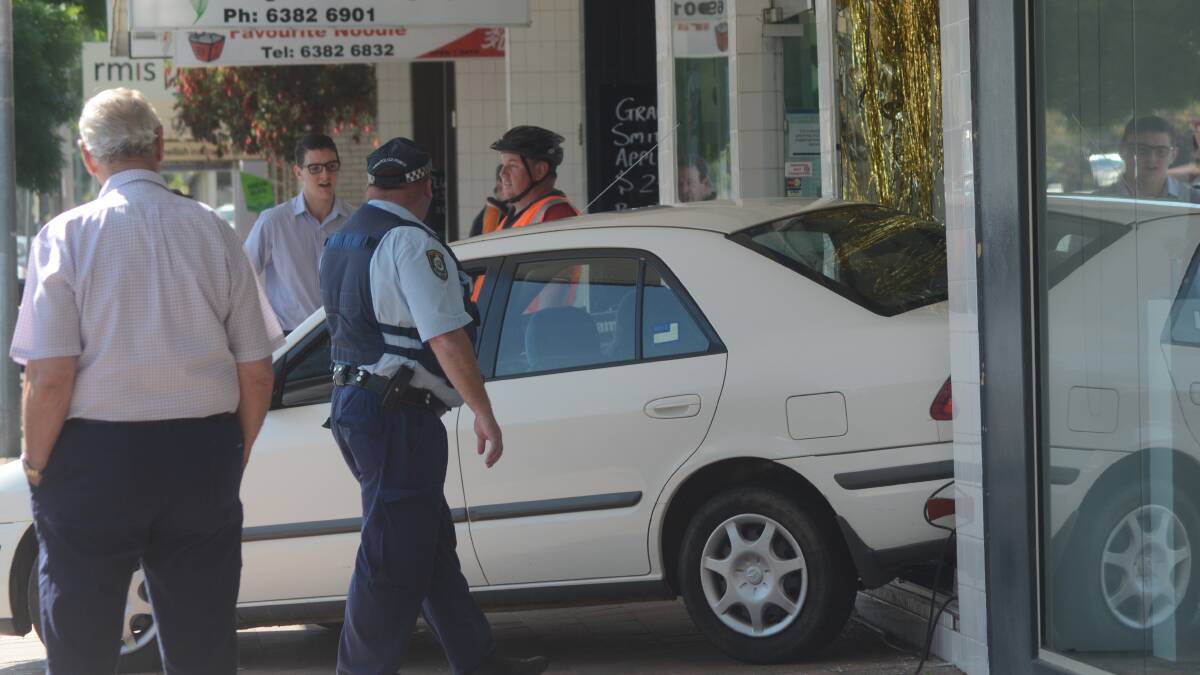 A car crashed through the front window of Blooms Pharmacy in Young on Wednesday morning. Picture: Young Witness
