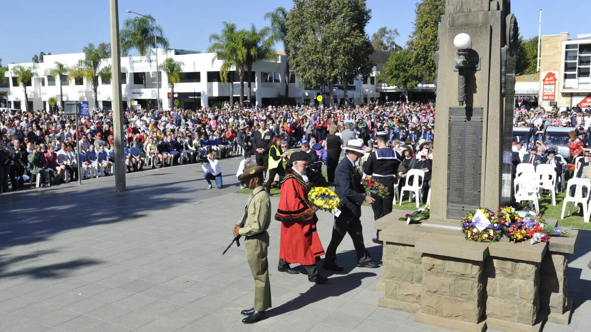 Wagga mayor Rod Kendall and RSL sub-branch president Kevin Kerr lay wreaths at the cenotaph during the Anzac Day service. Picture: Les Smith