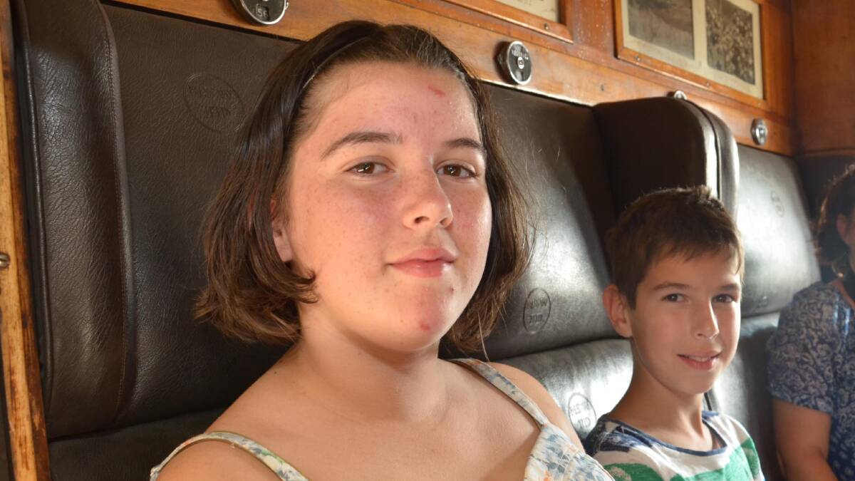 Sarah Price, 13, and Alex Price, 10, from Wagga get ready for a ride on the steam train. Picture: Declan Rurenga