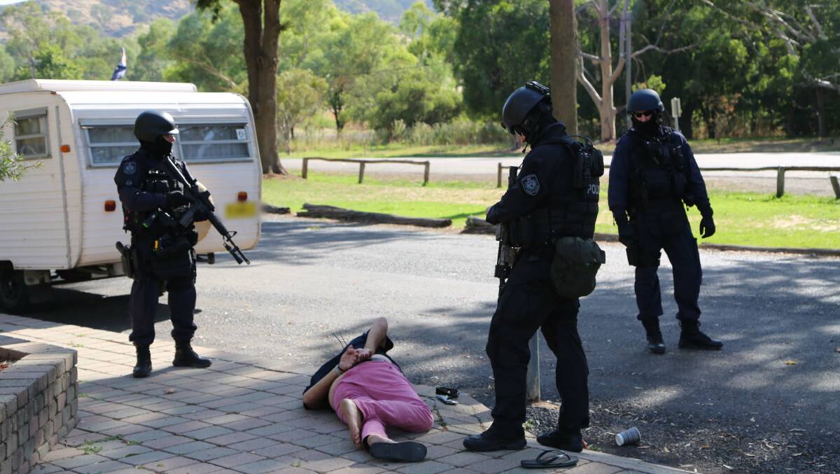 ARREST: Police arrest one of the three accused near Gundagai. Picture: NSW Police