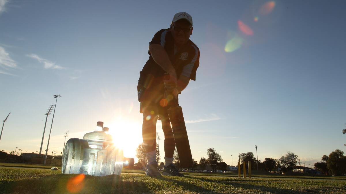 NOT JUST THE WATER: Renowned Wagga cricket coach Warren Smith OAM practices his form at Mark Taylor Oval. Picture: Brodie Owen