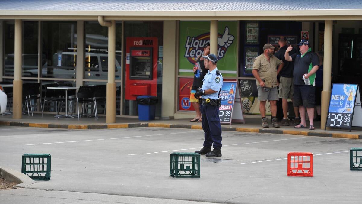 CHASE: A police officer stands guard over evidence in the carpark of the Forest Hill shopping centre on January 9. Picture: Michael Frogley