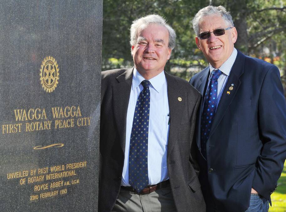 INVALUABLE: Peter Gissing (left) and John Egan at one of Rotary's important community service projects in Wagga – the peace monument. Picture: Kieren L Tilly