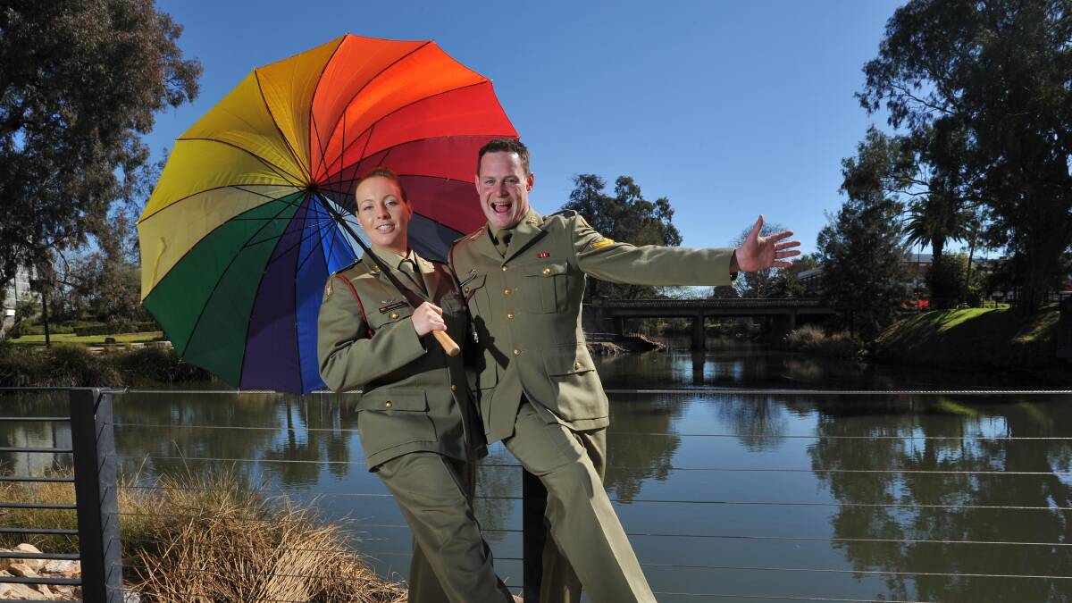 SINGING IN THE SUN: Musician Natasha Fox and Corporal Dave Shuttleworth from the Australian Army Band Kapooka get in the mood for Don't Rain On Our Parade. Picture: Laura Hardwick