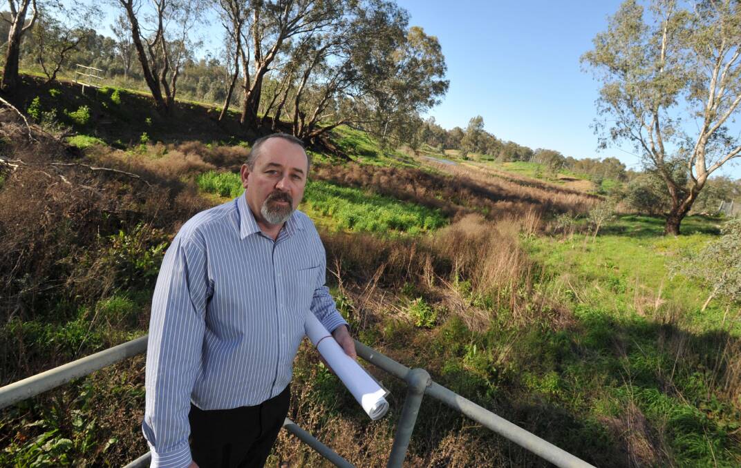 WETLAND WONDER: Tony Phelps above one of the disused effluent ponds that will be transformed into a vital wetland off Narrung Street. Picture: Michael Frogley