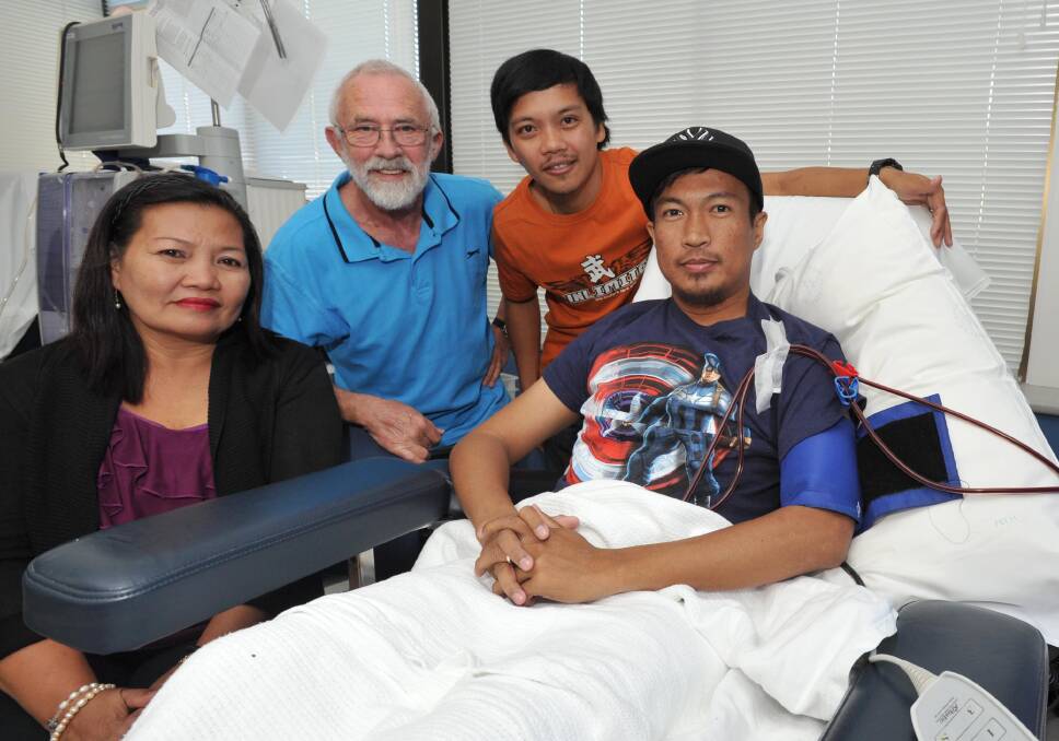 HERE TO HELP: With Rex Flores as he undergoes dialysis are (from left) his mother Yolanda, Graeme Callander and Rex's brother Rowell. Picture: Michael Frogley