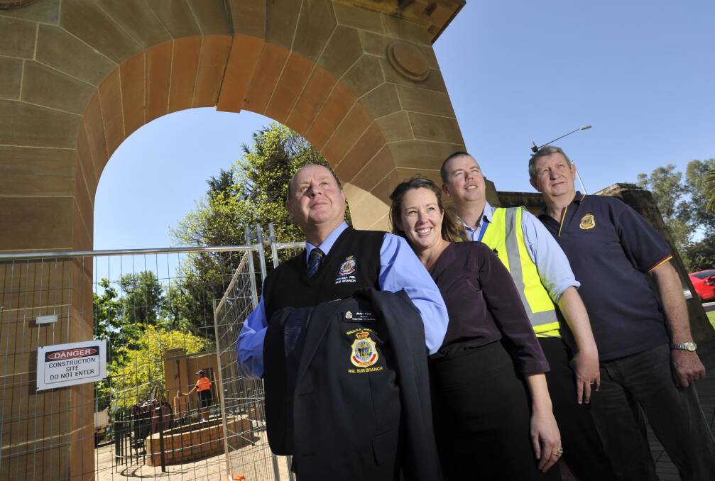 ETERNAL FLAME: (from left)  Brian Watts, Jo Thomas, Wagga City Council strategic asset planner for parks and recreation Ben Creighton and  Kevin Kerr at the memorial arch in the Victory Memorial Gardens where work has started on upgrading the eternal flame (in background). Picture: Les Smith