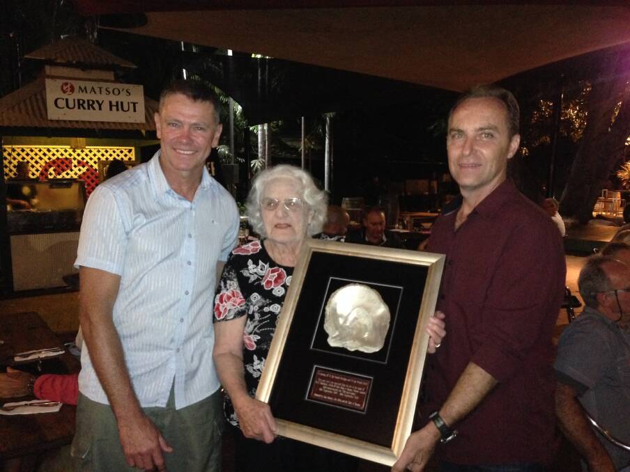 SPECIAL GIFT: Ron Kerrigan's sister Val Bullied with the framed shell presented to her by Jim Miles (left) and Dion Maranis. Picture: Jo Elkington