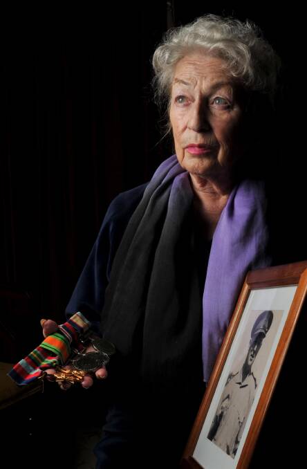 MEMORIES: Linda Douglas holds a 1941 photograph of her father and his World War II medals. Brigadier Varley's WWI medals were kept by his son, Jack, but were lost in a house fire. Picture: Michael Frogley 