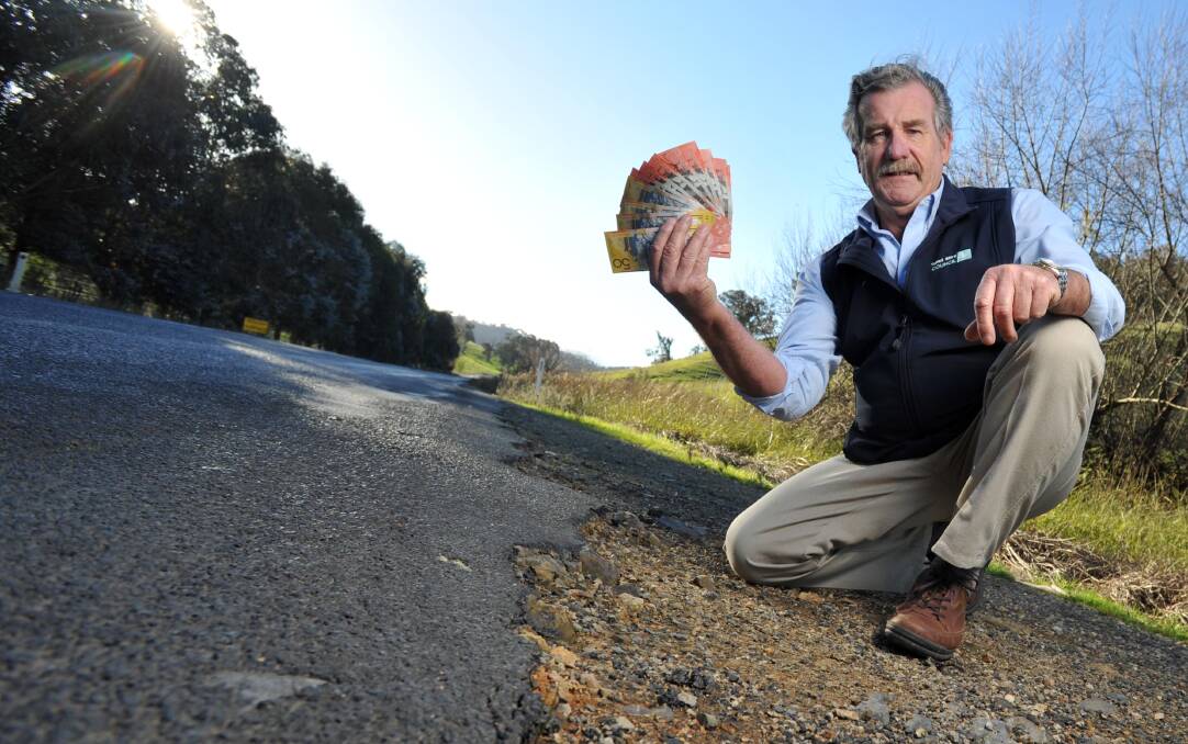 ROAD MONEY: Tumut Shire Council's director engineering services John Maxwell beside the Gocup Road which desperately needs an injection of cash for improvements. Picture: Michael Frogley