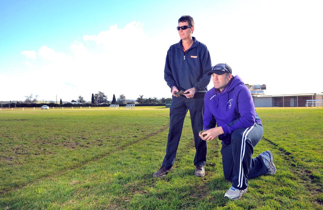 Southcity president Rodney Porter and club official Greg Wiscombe inspect the damage at Harris Park yesterday. Picture: Kieren L Tilly