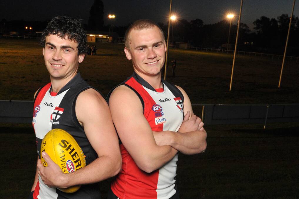 Chad and Kirk Hamblin enjoy their first training run with North Wagga on Thursday night. The brothers will co-coach and assistant coach the Saints for 2015. Picture: Michael Frogley