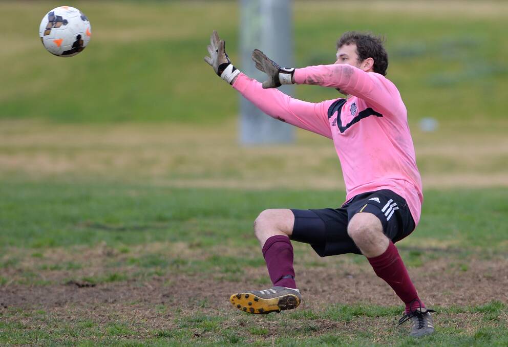 Wanderers keeper Aaron Thomas saves another Yoogali SC strike at Gissing Oval.
