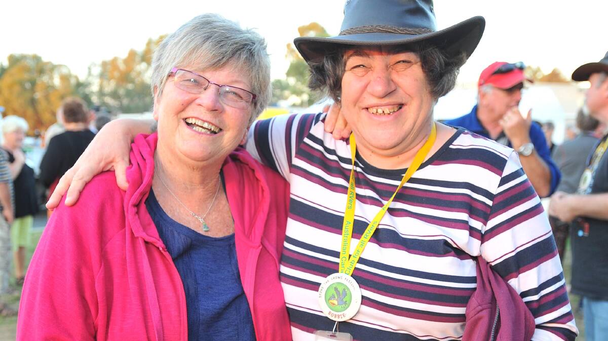 Marg McAlister, from Oak Flats, and Bobbie Hardy, from Ruse, catch up for a chat at Wagga's Stone the Crows Festival on Thursday. Picture: Kieren L Tilly