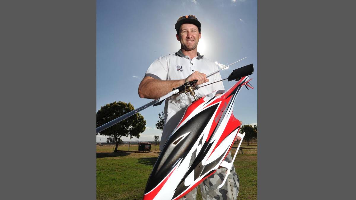 Wagga Model Aero Club's Brendan Tucker looks over one of his competition helicopters. Picture: Michael Frogley