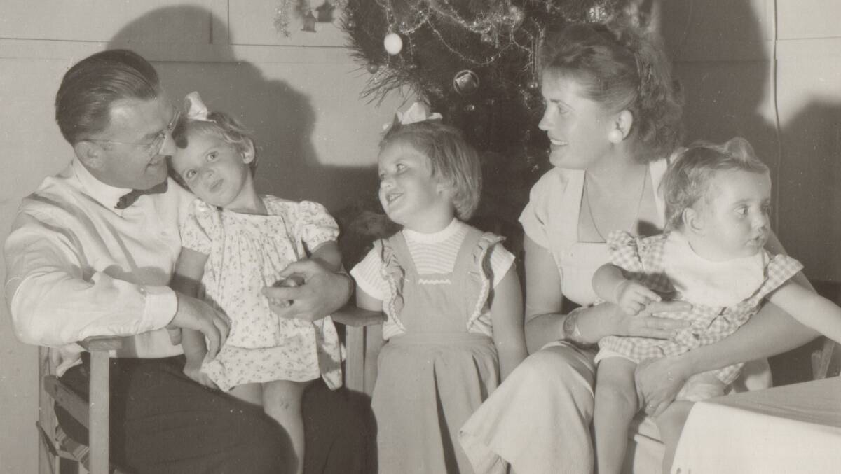 Merry Christmas from the Museum of the Riverina. In this picture Zvonimir and Sonia Hribar are enjoying their first Australian Christmas with their three daughters at Bonegilla Migrant Camp, 1955. 