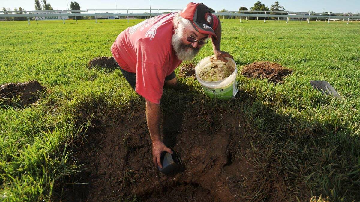 Plumber Fred Hay is tasked with fixing a crack in the Murrumbidgee Turf Club drainage system on Tuesday. The day's racing was called off because of the problem. Picture: Alastair Brook