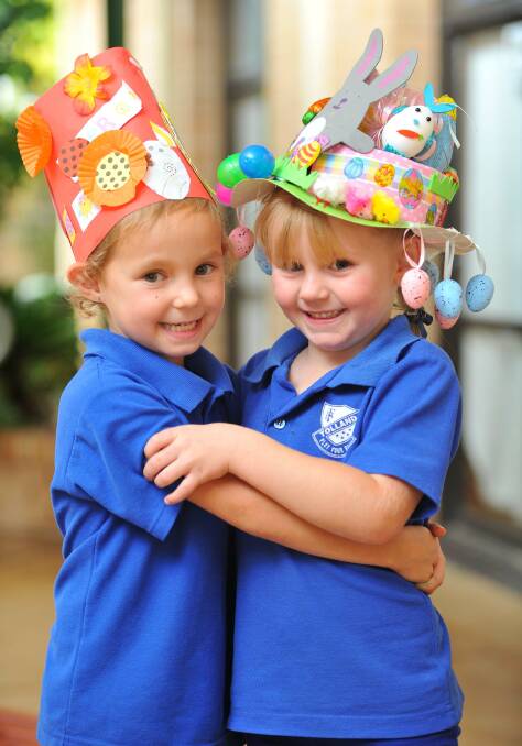 Shanice Amos and Pearl Post, both 5, at the Tolland Public School Easter hat parade. Picture: Kieren L Tilly