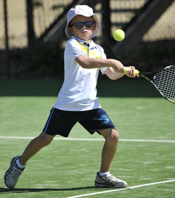 Cool as a cucumber at junior tennis is eight-year-old Heath Elliott. Picture: Les SMith