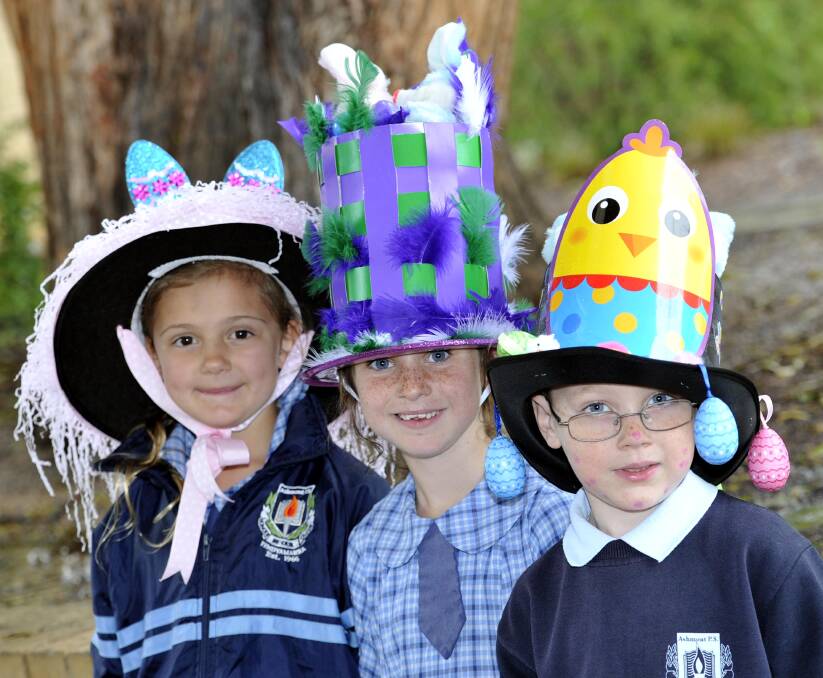 Tyra Lawrence, Kaelin Lyons and Zane Manns, all 7, at the Ashmont Public School Easter hat parade. Picture: Kieren L Tilly