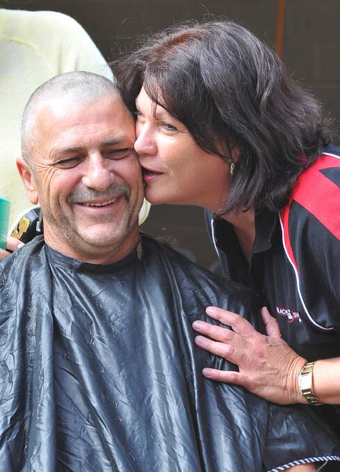 Black Swan Hotel publican Chris Tipping, pictured with his partner Alison, also shaved his head for leukeamia. Picture: Kieren L Tilly