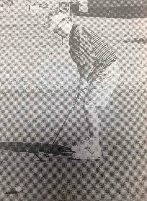 Darryl Binney, 12, putting on the 18th green, playing for Wagga Country Club in the RDGA pennants.