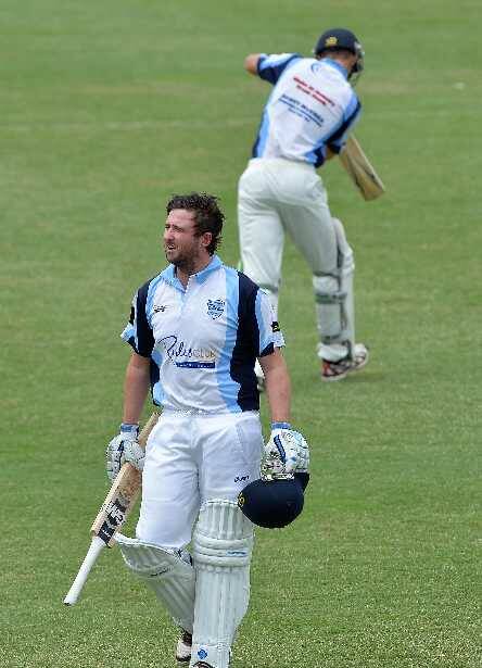 A dejected Joel Robinson passes Michael Mattingly after being dismissed during the South Wagga v Wagga City game at Robertson Oval on Saturday. Picture: Michael Frogley