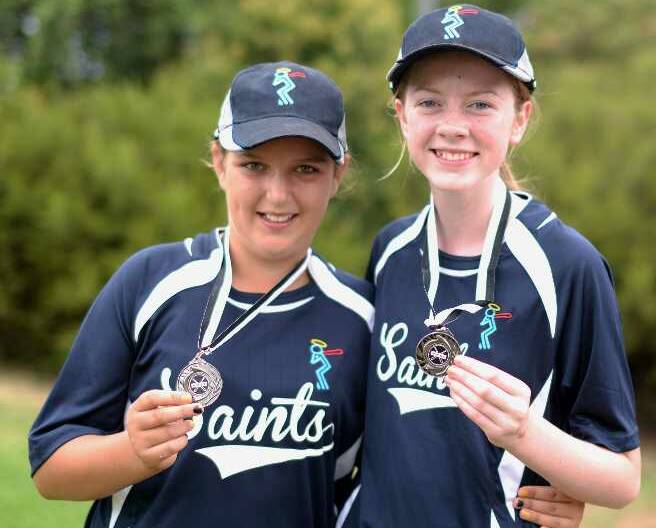 UNDER 14S: Saints team members Thea Knobel and Lilly Treston celebrate their Under 14's girls premiership win. Picture: Jacinta Coyne