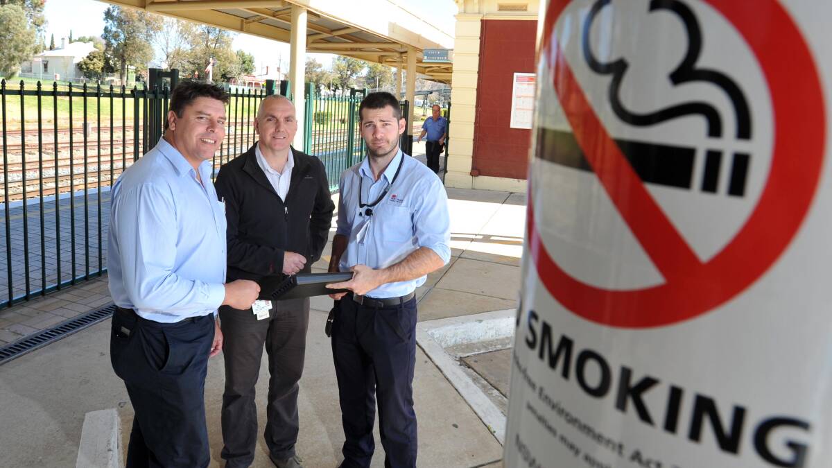 Senior tobacco enforcement officer Chris Woutersz, tobacco compliance officer Ian Hardinge and tobacco enforcement officer Shannon Moscardo discuss
smoking regulations yesterday. Picture: Michael Frogley