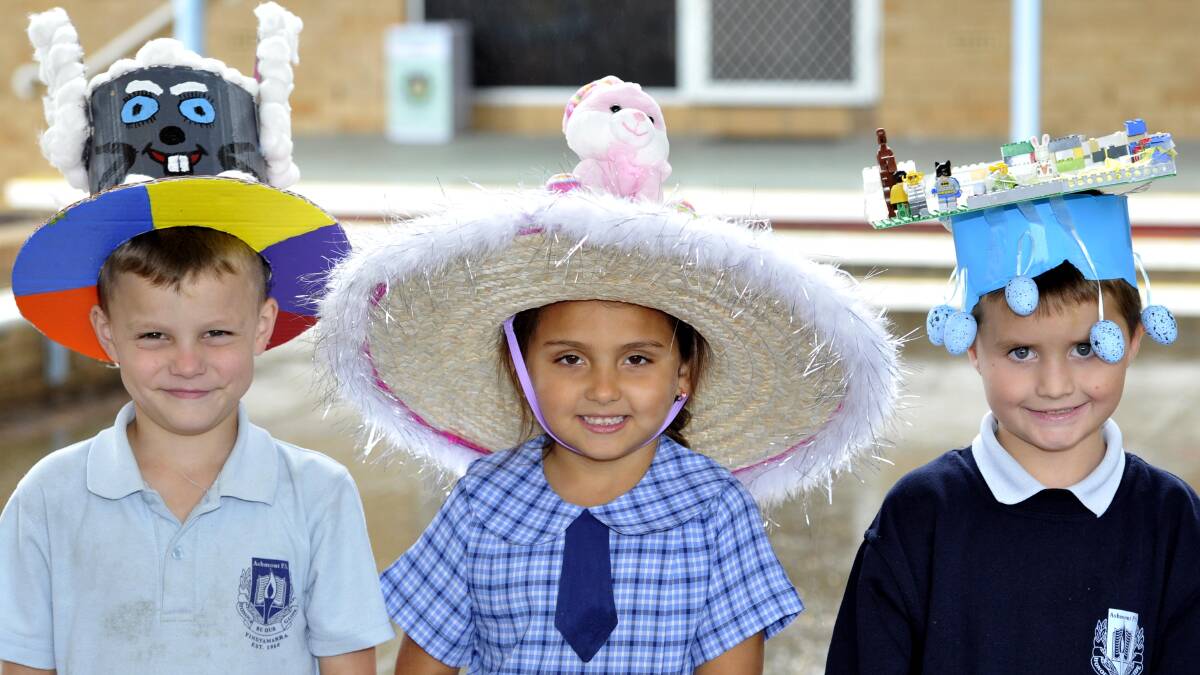 Leiland Allen, 6, Shaelah Black, 6, and Tyler Thomson, 7, at the Ashmont Public School Easter hat parade. Picture: Kieren L Tilly