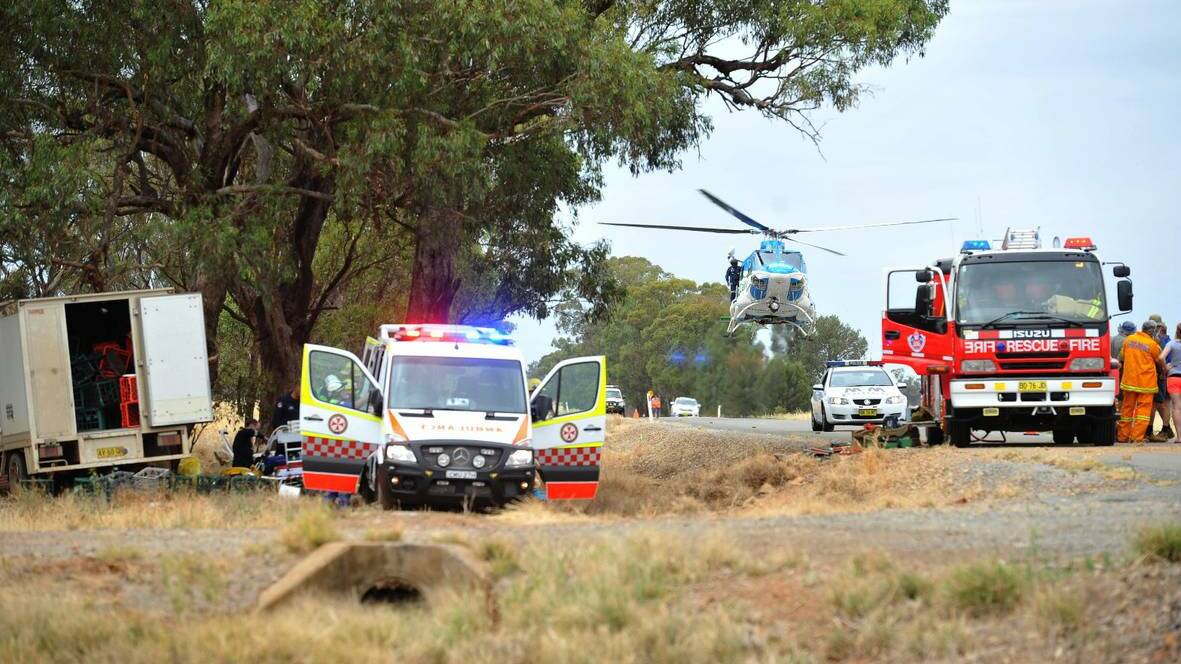 The SouthCare helicopter arrives at the crash scene where a Coolamon man hit a tree about 20 kilometres from Coolamon. Picture: Alastair Brook