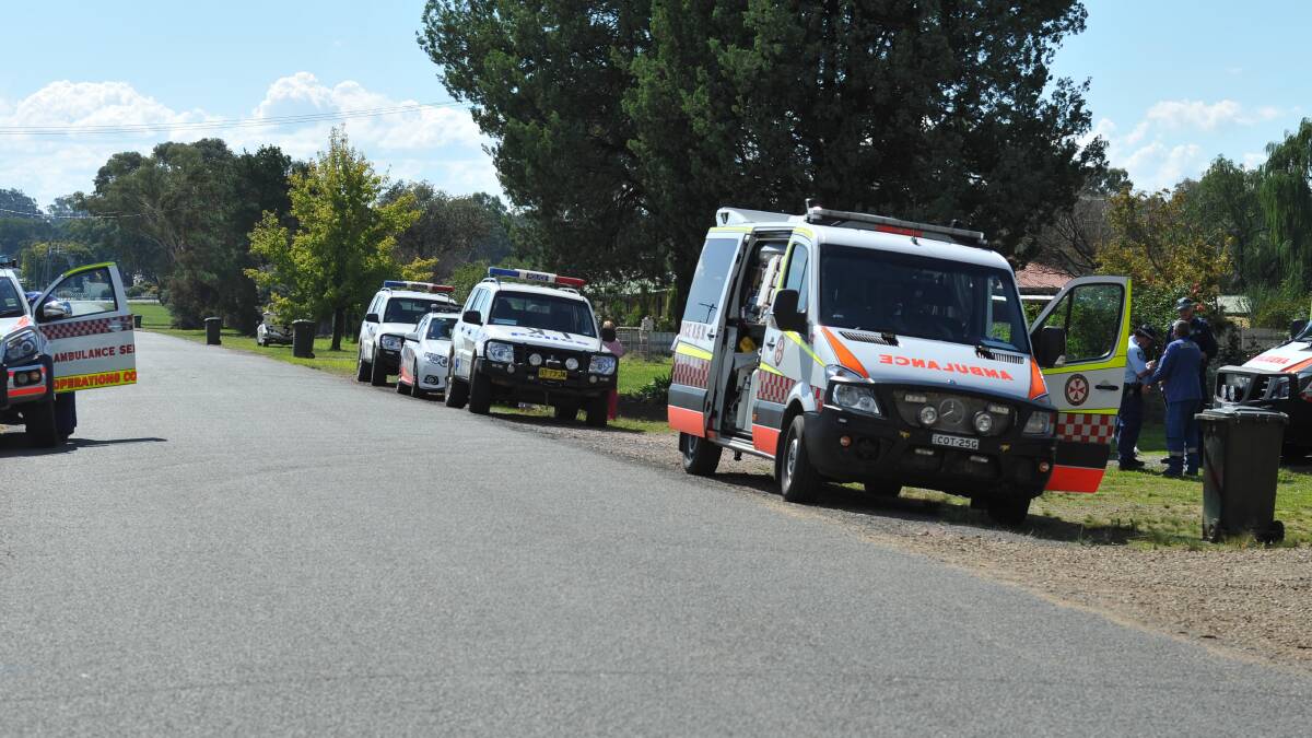 Ambulance and police vehicles outside a Scott Street house at The Rock on Wednesday. Emergency personnel were unable to revive a man who was found in cardiac arrest. Picture: Laura Hardwick