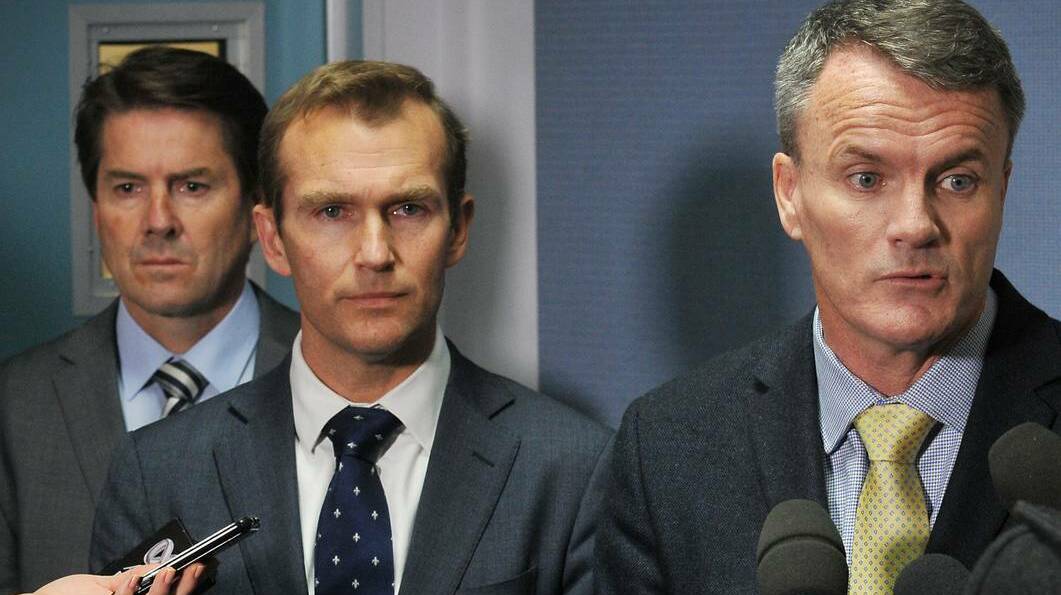 Environment Minister Rob Stokes, pictured centre with department chief Terry Bailey, right, and local MP Kevin Anderson, left, said they were aware of the issues in the Croppa Creek area which has now seen all operations on the ground suspended after Tuesday’s alleged murder. Photo: Gareth Gardner