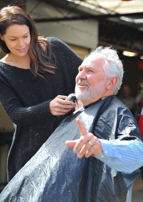 Wagga mayor Rod Kendall raised $250 to shave his head and beard at a World's Greatest Shave event at the Black Swan Hotel. Alexandra Lucas had the honour of shaving Cr Kendall's head and trademark beard. Picture: Kieren L Tilly