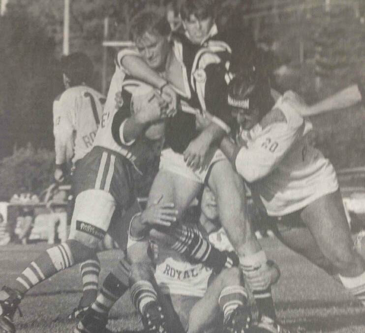 Magpies player Mark Scott struggles to stay on his feet as three Temora defenders try to wrestle him to the ground. The Magpies defeated the Dragons 36-26.